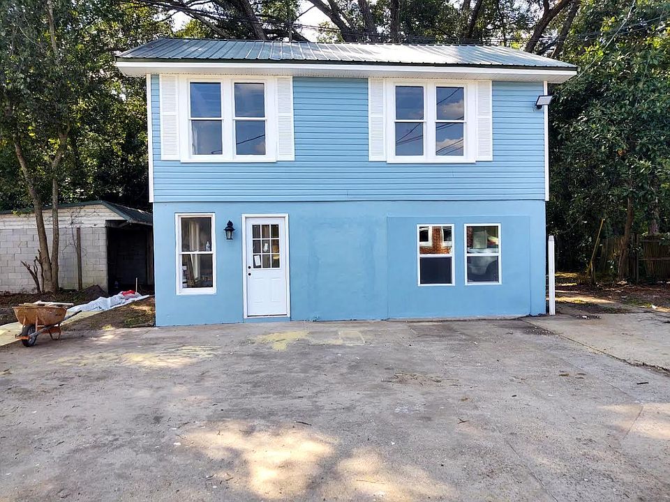 2 Story Carriage House conversion: bed, bath, and kitchen upstairs. Landry and 2nd bedroom downstairs.