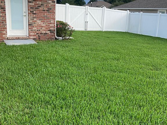 Fenced out backyard - other view