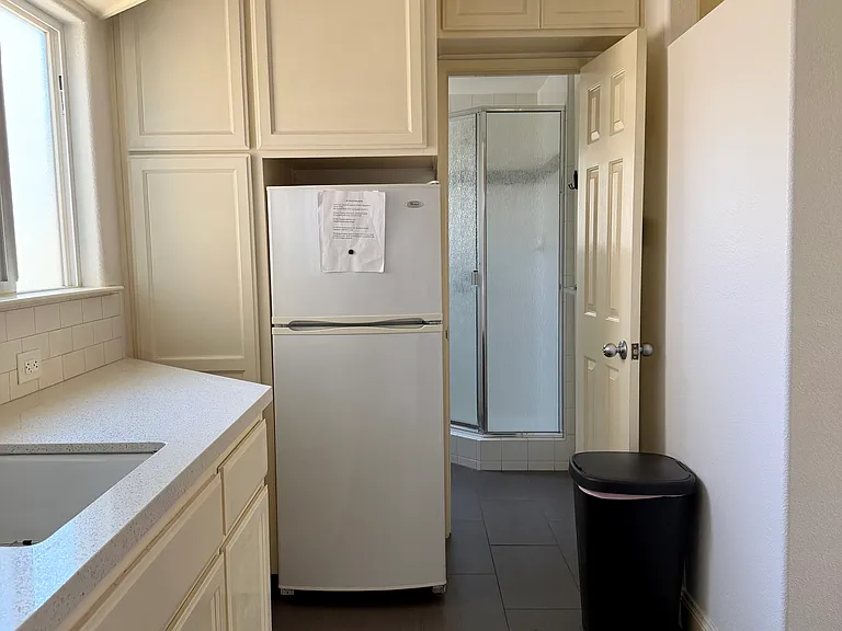 Kitchen facing bathroom.