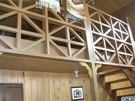 Inside has that "Western" feel with big wood beams and a loft with wood trim.