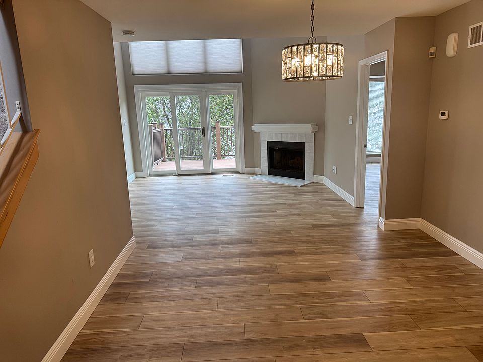 Main floor entry. All new flooring with a wood burning fireplace and door that leads to a composite deck. Freshly painted.