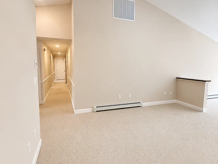 Family room looking down hallway to garage door