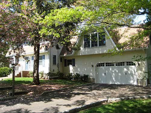 Great Room with vaulted ceiling above oversized garage