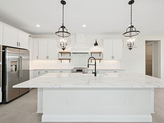 Kitchen with stylish floating shelves