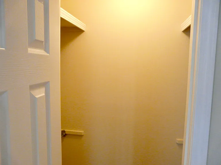 His walk-in closet!! (Her closet is identical, and both are located between the Master Bedroom/Bath