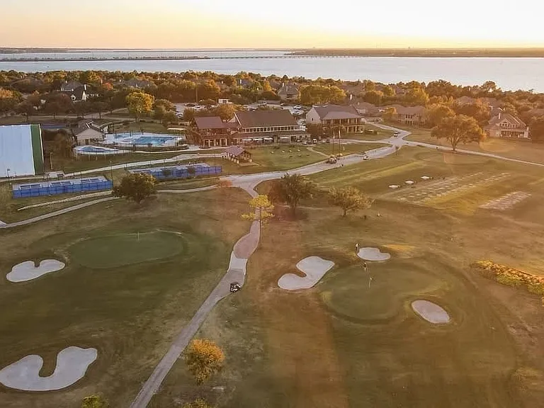 Expansive golf course featuring multiple greens and sand traps