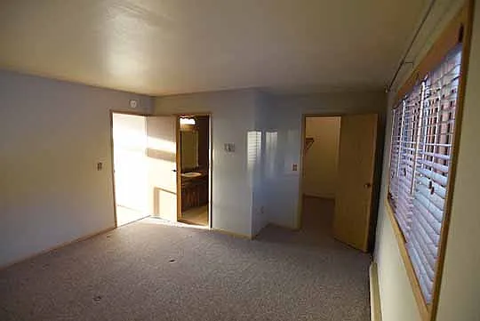 Master bedroom with full bathroom and walk-in closet located on second floor behind the living room and kitchen.