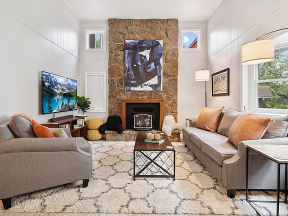 Living Room 1 of 2. Mounted big screen TV -- bring your own streaming services!