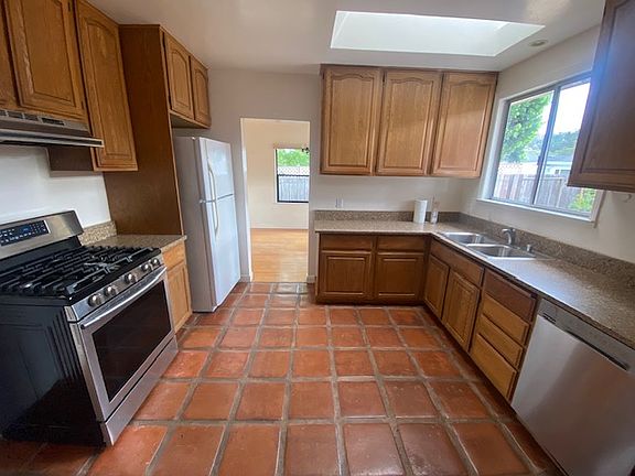 Very spacious kitchen with new stove and dishwasher