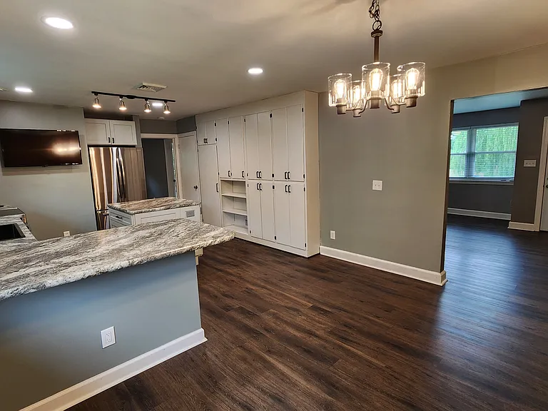 From the dining area looking back to the front door. Bedroom number two off the back of the kitchen