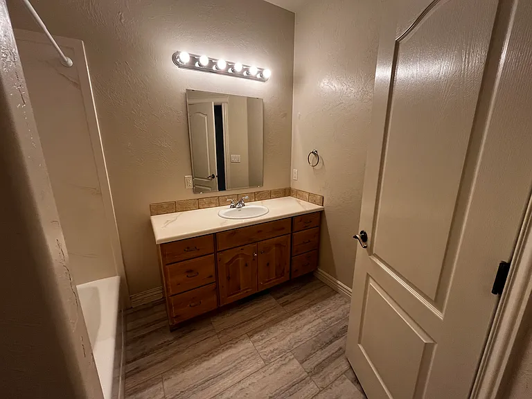 Main level bathroom with brand new Pergo flooring