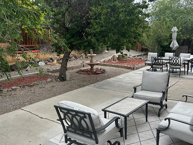 Back yard. this patio bench, 2 charis and table belong to tenant and do not stay