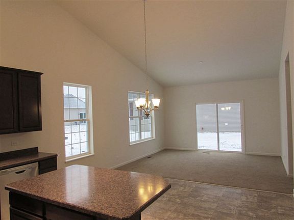 The family room features an entryway providing easy access to the yard.