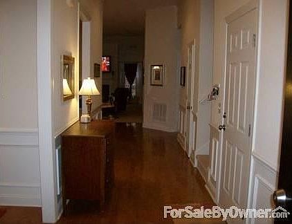 Foyer
						:
						View from front door; picture molding and hardwood floors