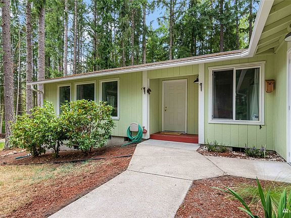 Entrance to front door and side garage door>