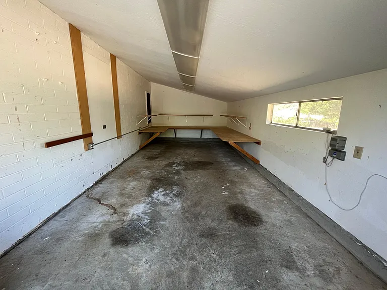 A large creative workshop space is connected to the garage.