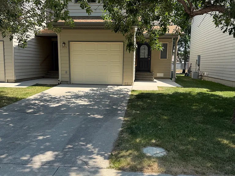 Front door, off-street parking, single car garage.