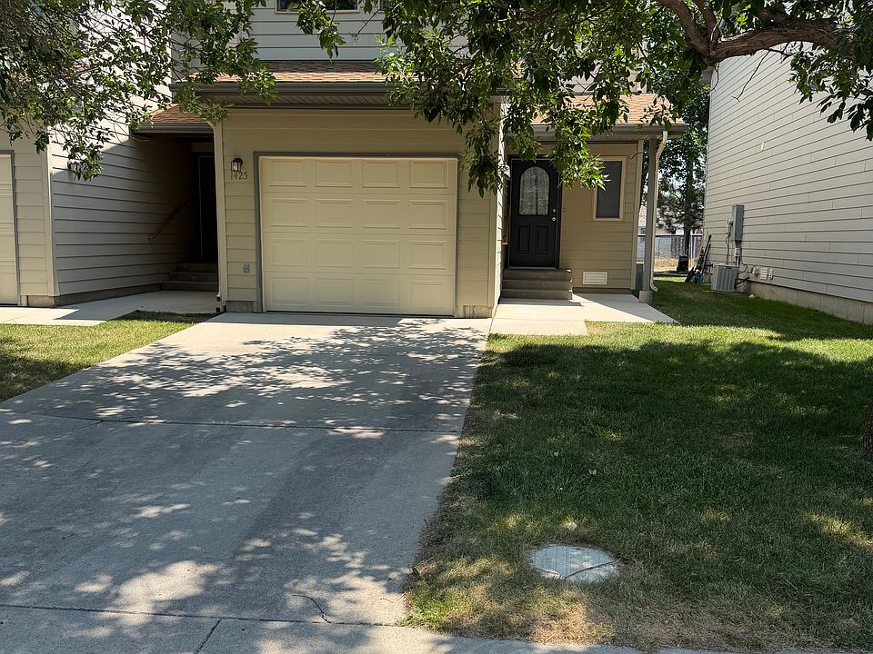 Front door, off-street parking, single car garage.