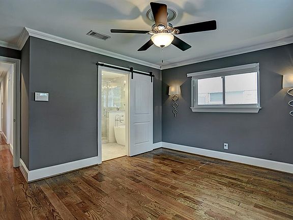 Master bath with sliding barn door.