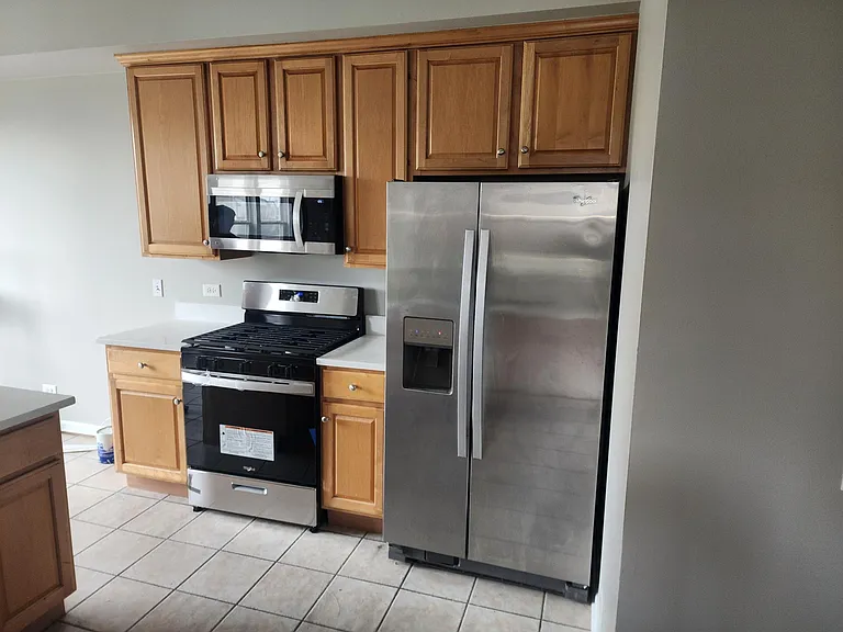 Newer Appliance - Whirlpool Gas Oven Range and LG Microwave