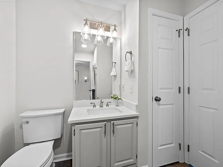 2nd bath with linen closet storage.