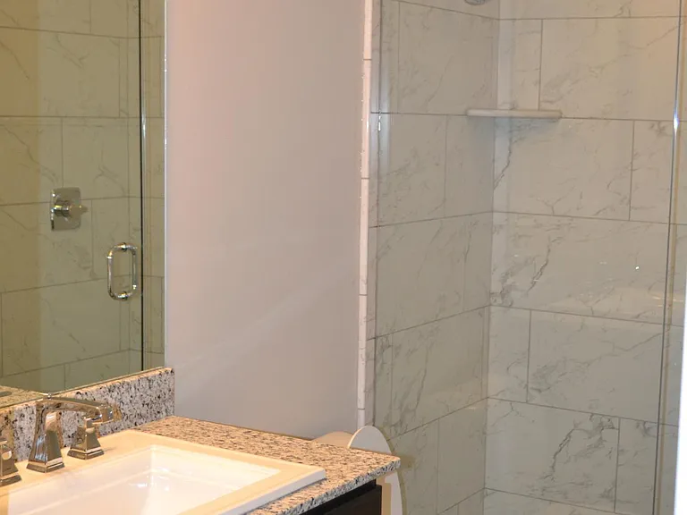 Tile Showers. Granite Vanity.