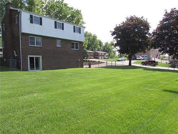 It is located on a Beautifully Landscaped Double Corner Lot in a Tree-Lined Community
