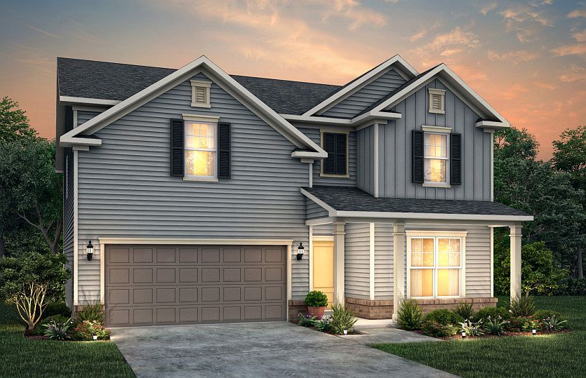 Pennington LC2G features siding, brick accents, covered front porch and 2 car garage