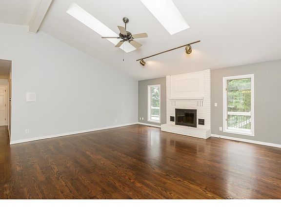 Vaulted great room with hardwood floors