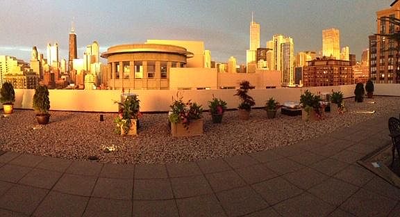 Panoramic image is warped trying to capture the full length of the deck.. New building was constructed on NE side however still nice view of Hancock. Beautiful sunrises