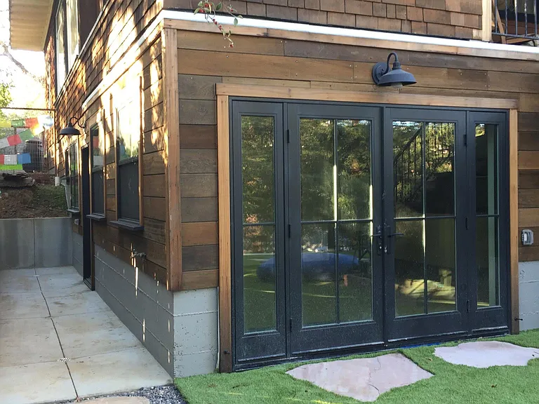 View showing side (main) entry and French doors onto terrace. We now have a gate for the side yard (see additional photos).