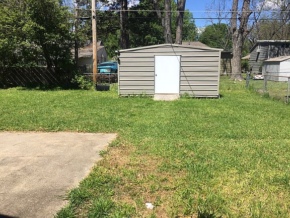 FENCED BACK YARD WITH SHED