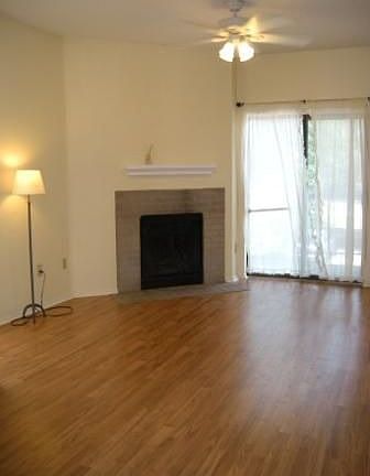 Light & bright living room with fireplace and private balcony