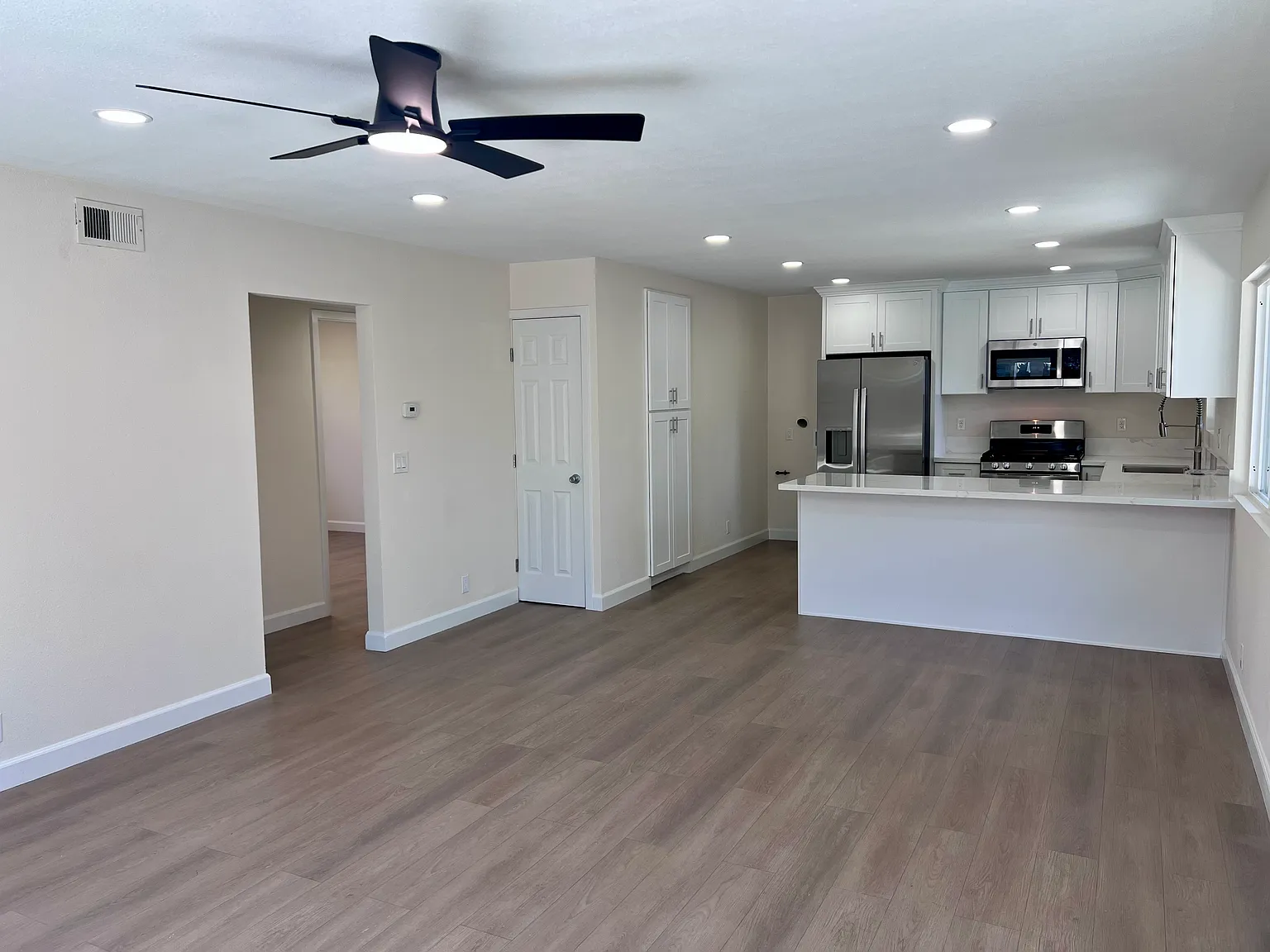 Ceiling fans and recessed lighting throughout