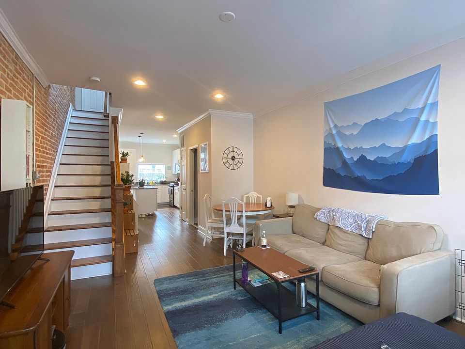 Large open living room w/Hardwoods and recessed lighting, exposed brick!