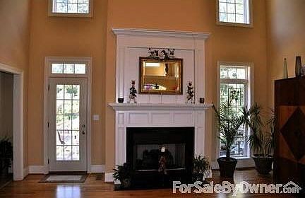 Entry and Living Room
						:
						Bright, Open Space, Golden Oak Floors, 18 foot Ceiling, Iron and Oak Staircase