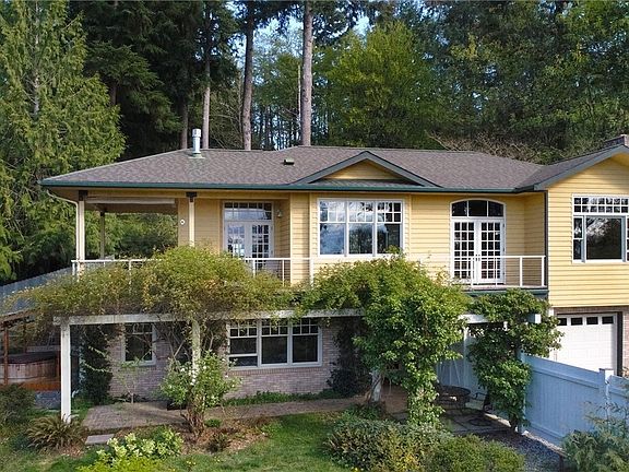 Here you can see the attached two-car garage and garden shed in left-hand corner. This well-built home is calling to you!