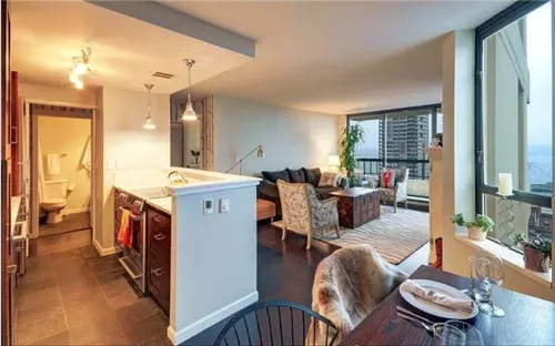 Living room with breathtaking Puget Sound sunset views - 2201 3rd Ave #1503