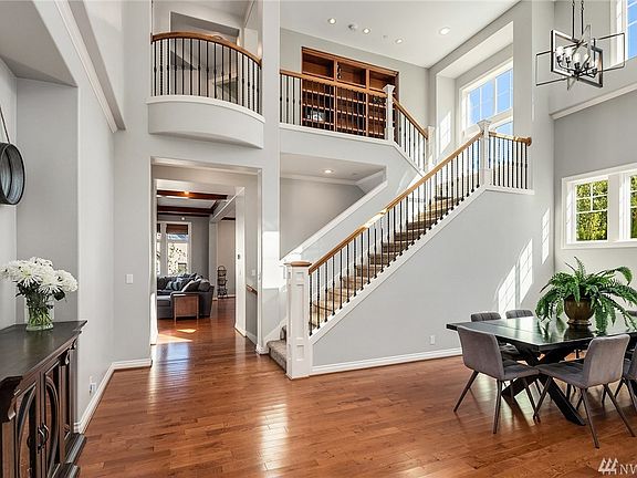 Soaring ceilings and extensive hardwoods on this beautiful main floor. Check out the built ins at the top of the stairs!