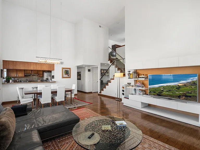 Stairs from living room to guest bedroom, bathroom, terrace
