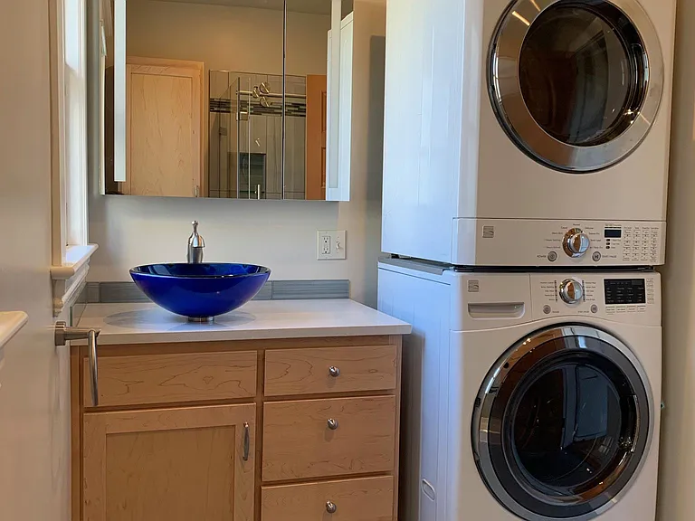 first floor bathroom and laundry. There is also a washer and dryer in the basement utility room