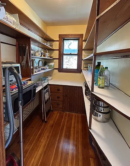 Spacious pantry from 1909 offers pots and pans and all you need to store your items for your favorite meals!