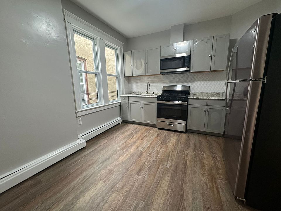 Kitchen with range, oven, fridge
