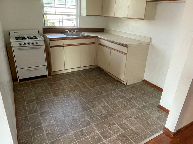kitchen has space. the oven is currently replaced with a bigger oven and bigger stove. along with the countertop