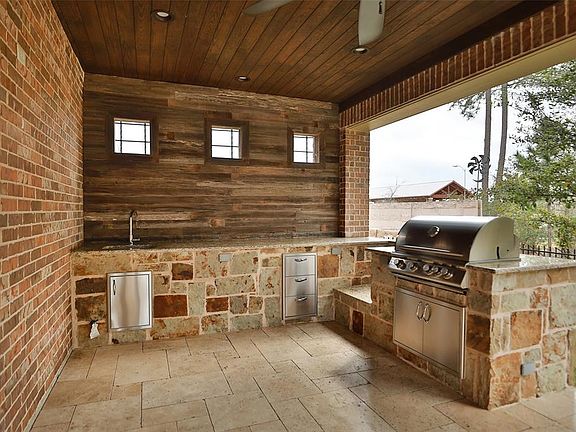 Amazing outdoor kitchen and living area! Cut out is for Green Egg or Crawfish boiler!