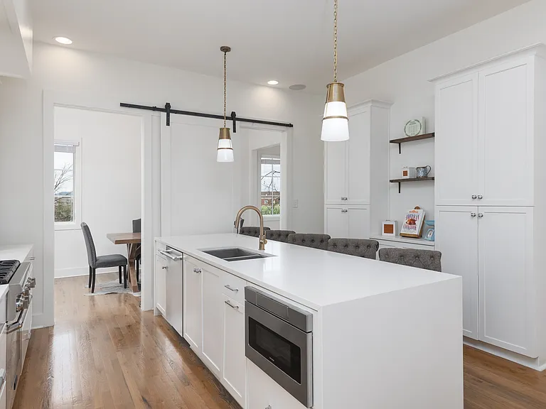 Fully equipped kitchen with stainless steel appliances, seating for 5 at the kitchen island, additional seating at the dining room table and all the dishware / utensils you might need.