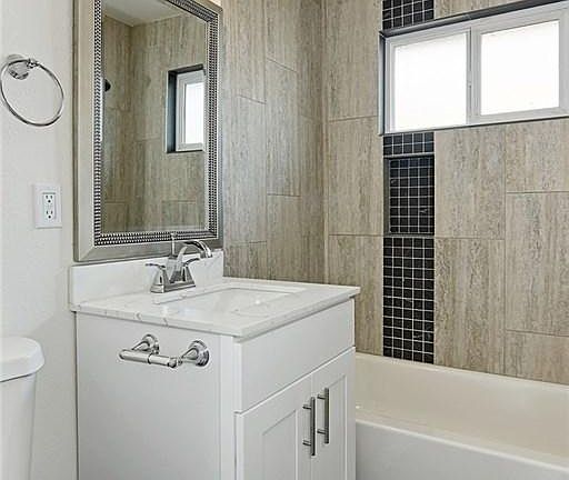 Newly constructed luxury bathroom with beautiful designer tile.