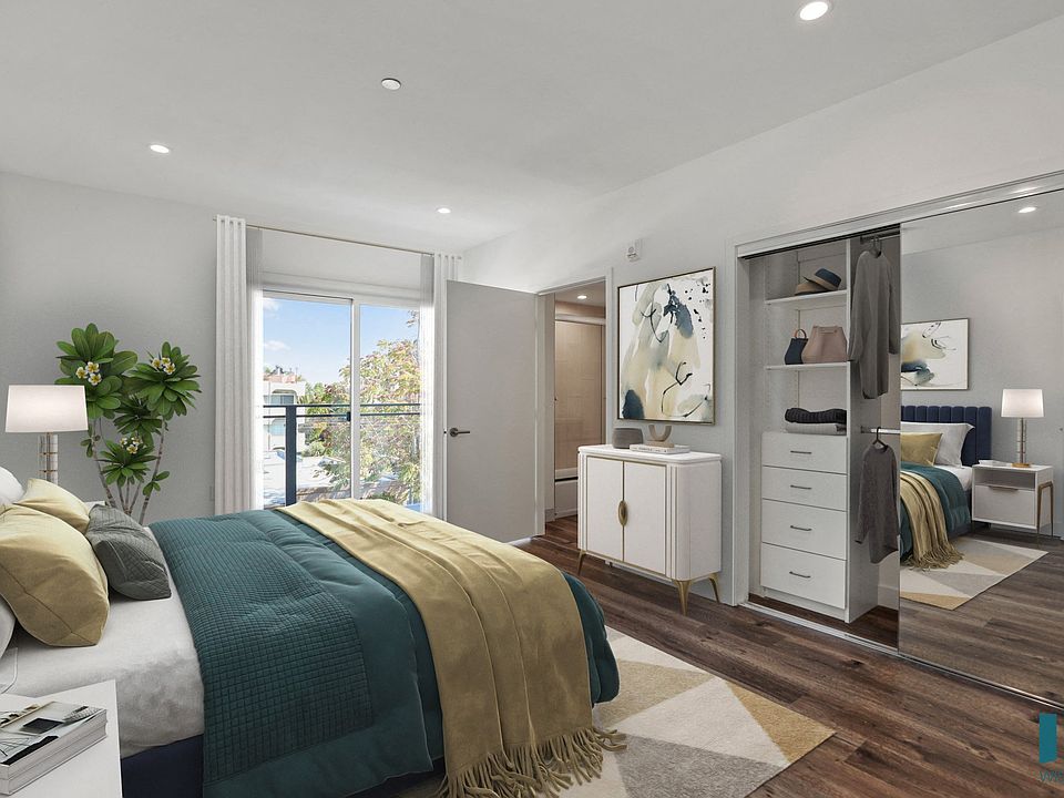 Bedroom with Mirrored Closet with Shelving, Recessed Lighting, Vinyl Flooring, and Balcony