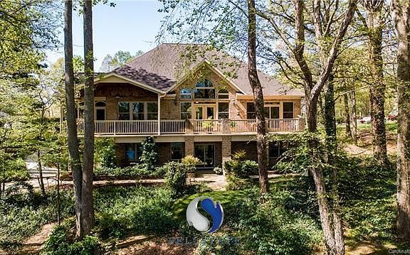 600 SQ.FT. LOWER LEVEL PATIO/600 SQ.FT. COVERED PORCH AND OPEN VERANDA/180 SQ.FT. SCREENED PORCH= ALMOST 1400 SQ.FT. OF OUTDOOR SPACE...AND THAT DOESN'T INCLUDE THE LAKE SIDE GAZEBO!SIP SOMETHING REFRESHING WHILE OVERLOOKING THE NATURAL BEAUTY OF THE LAKE.  WATCH THE FISH JUMP AND THE DUCKS TAKE A SWIM.