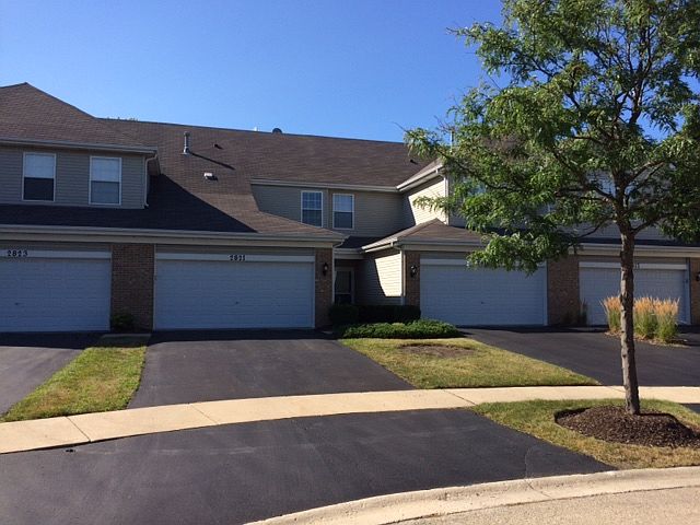 Attached 2 car garage with full driveway